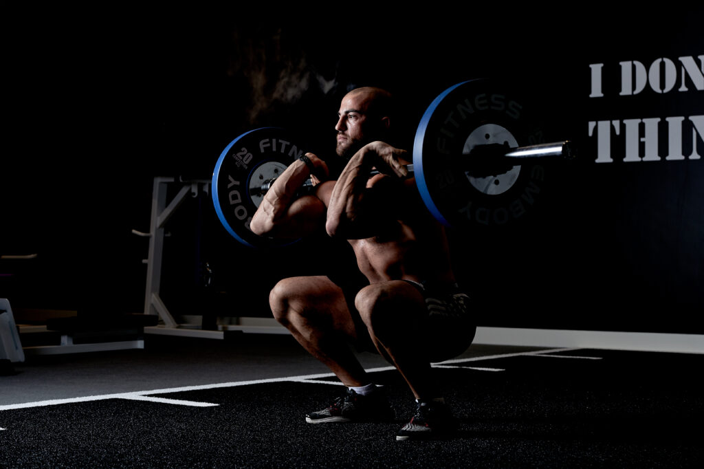 Embody personal trainer doing barbell front squats